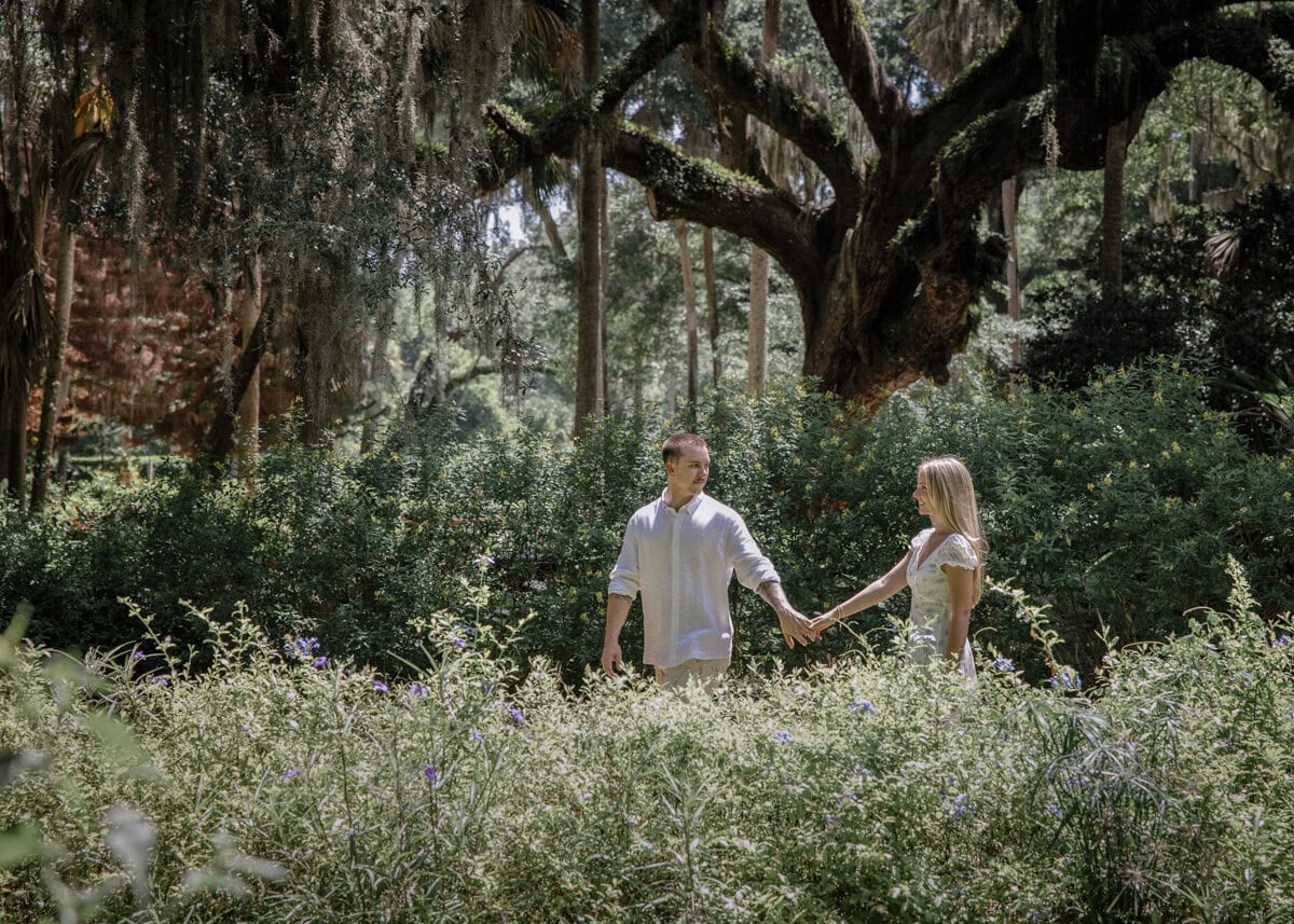 Couple walk through garden at Washington Oaks Garden State Park