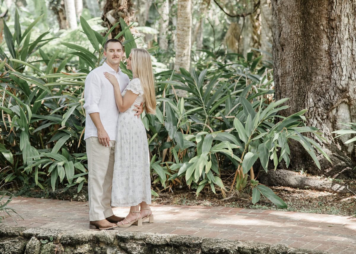Couple walk through garden at Washington Oaks Garden State Park