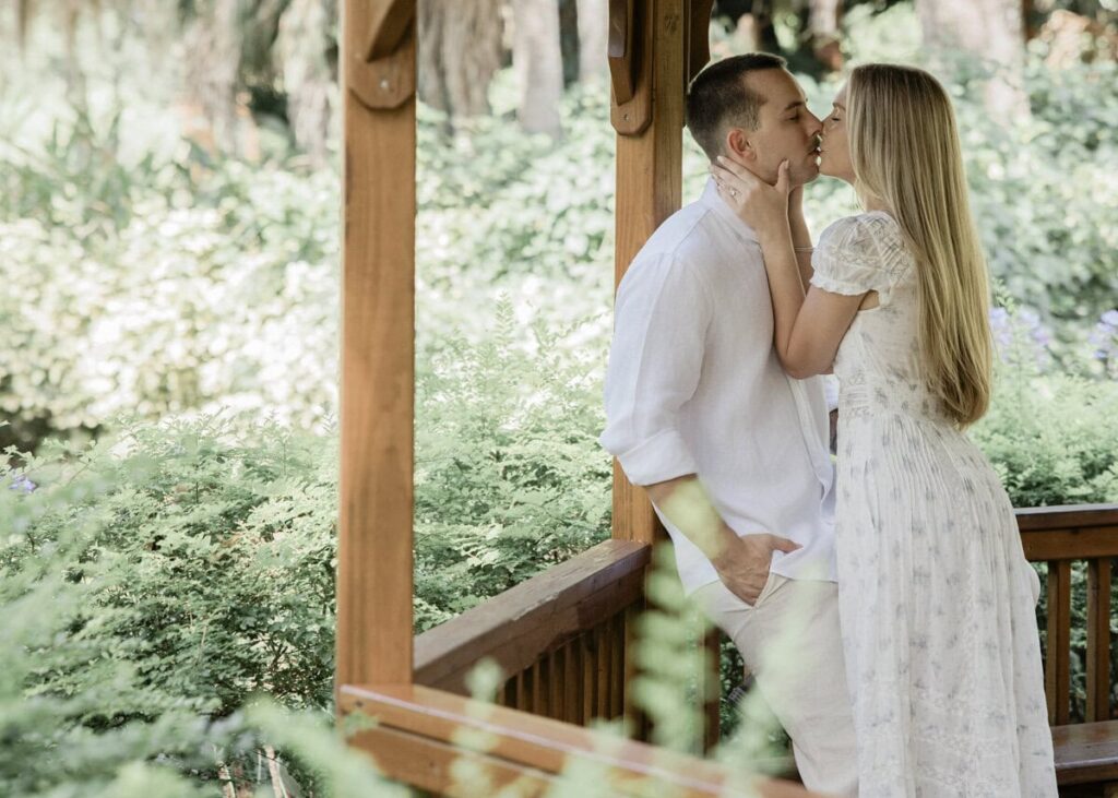 Couple walk through garden at Washington Oaks Gardens Engagement Photos